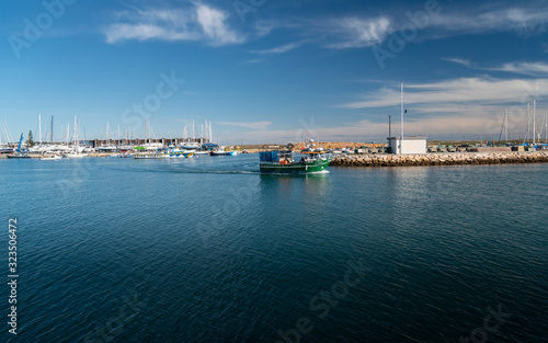 A fishing boat going out to sea in the Algarve, Portugal