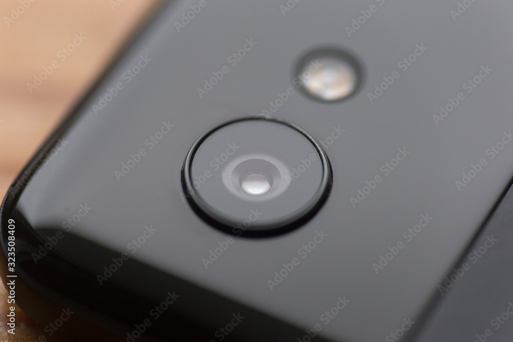 top view of google pixel smartphone lens on wooden background top view of google pixel smartphone lens on wooden background