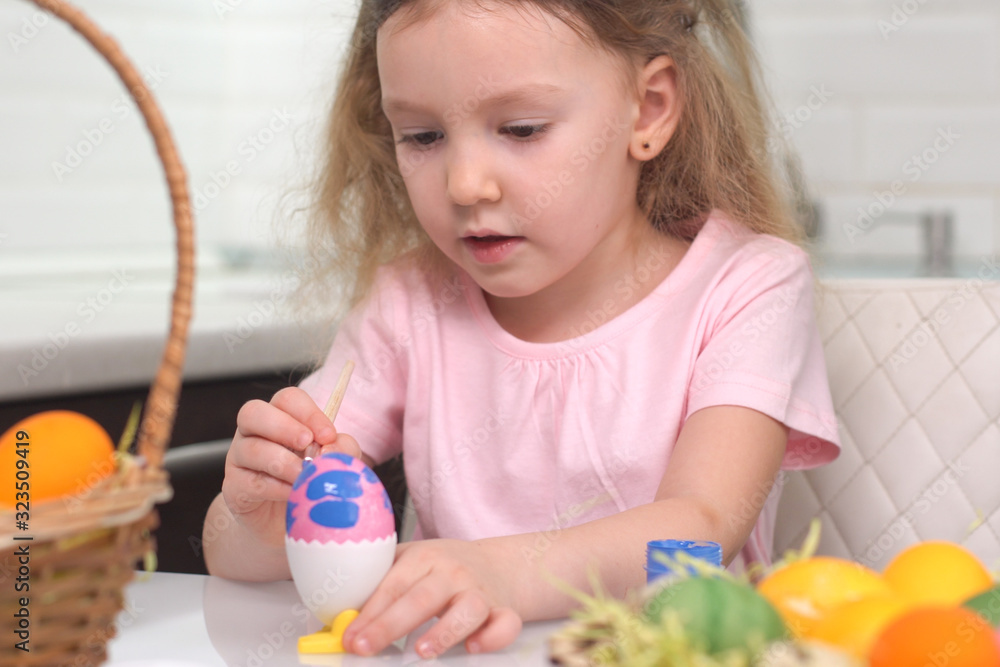 Happy easter. Little girl painting Easter eggs. Happy family children preparing for Easter. Cute little child girl wearing bunny ears on Easter day. Happy easter. Little girl painting Easter eggs. Happy family children preparing for Easter. Cute little child girl wearing bunny ears on Easter day.