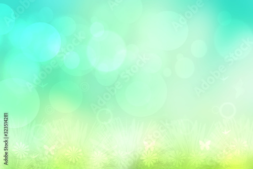 Hello spring background. Abstract bright spring or summer landscape texture with natural green yellow bokeh lights, sun, flowers on meadow and blue sky. Beautiful backdrop with space.