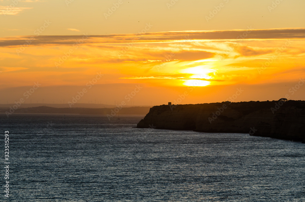 Sunset at Carvoeiro beach, Algarve, Portugal.