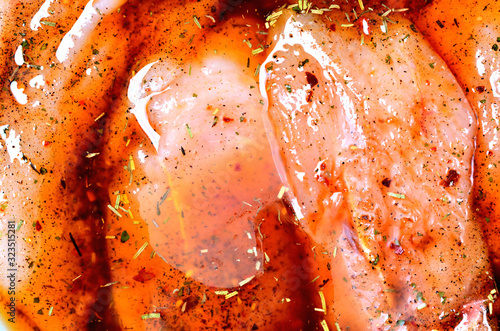 Tableau sur toile Raw turkey meat in marinade with spice, oil, thyme, rosemary and pepper