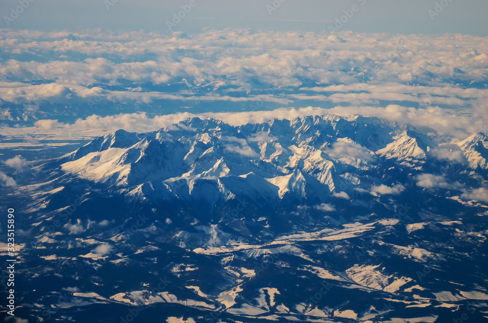 Fototapeta premium view of the Tatra mountains in winter from a height of ten thousand meters