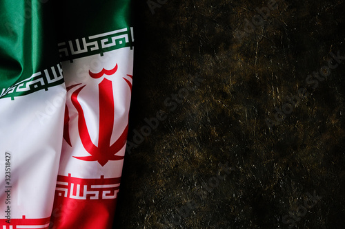 National flag of Iran on a dark background with space for text.