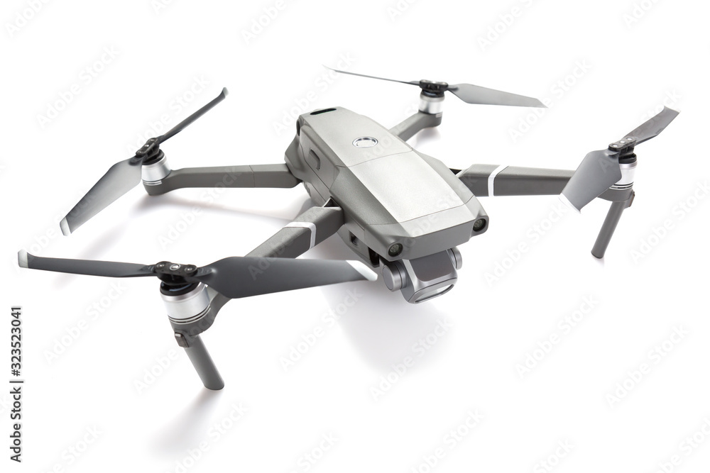 Modern drone quadcopter with a camera isolated on white background Modern drone quadcopter with a camera isolated on white background