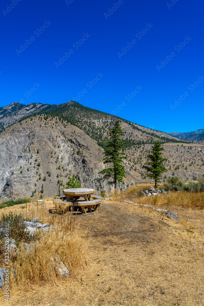 Picnic table over mountains and blue sky in Vancouver, Canada. Picnic table over mountains and blue sky in Vancouver, Canada.