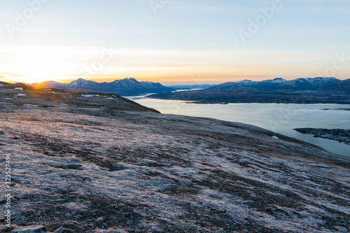 A photograph of the surrounding mountains around Tromso during sunset