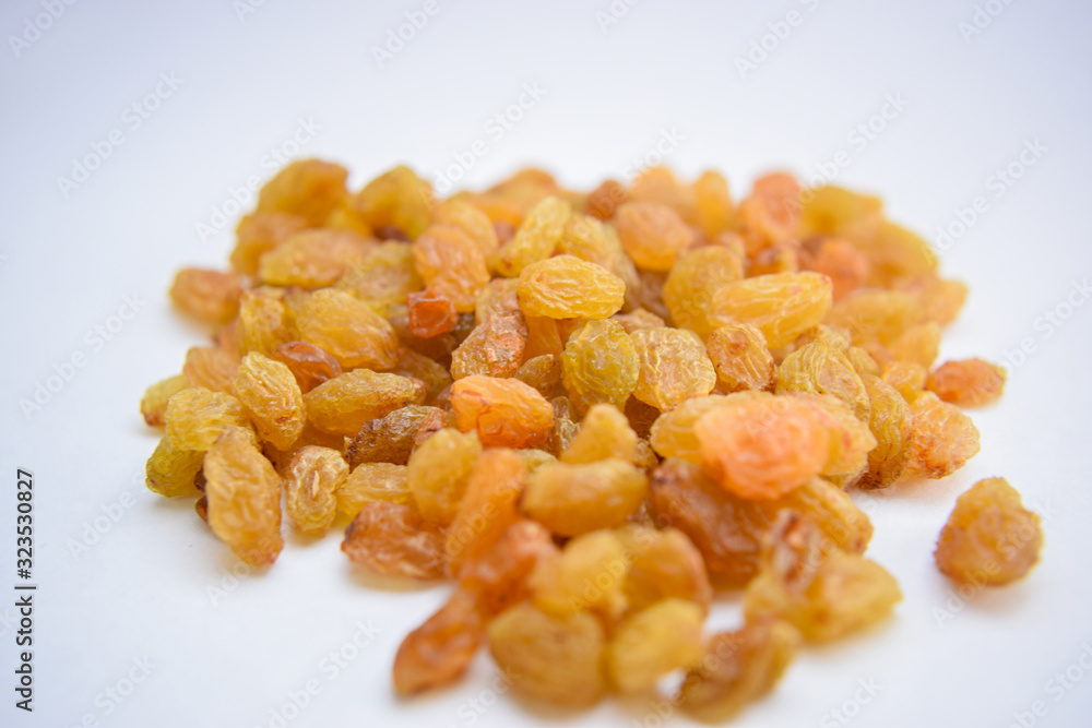 Yellow golden raisins isolated on white background Close-Up Stock Photography Image Yellow golden raisins isolated on white background Close-Up Stock Photography Image