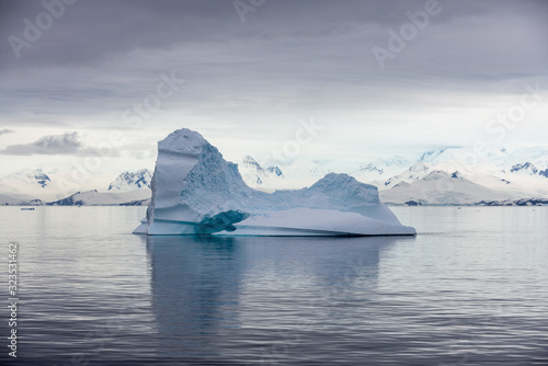 Antarctic landscape with iceberg, view from expedition ship © Alexey Seafarer