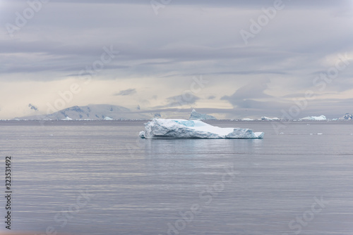 Antarctic landscape with iceberg, view from expedition ship