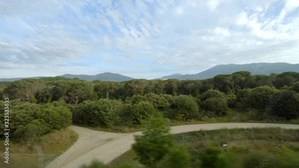 View from high speed train window. Beautiful landscape with several clouds View from high speed train window. Beautiful landscape with several clouds
