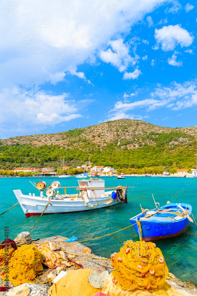 Colourful Greek fishing boats with nets on shore in Posidonio bay, Samos island, Greece
