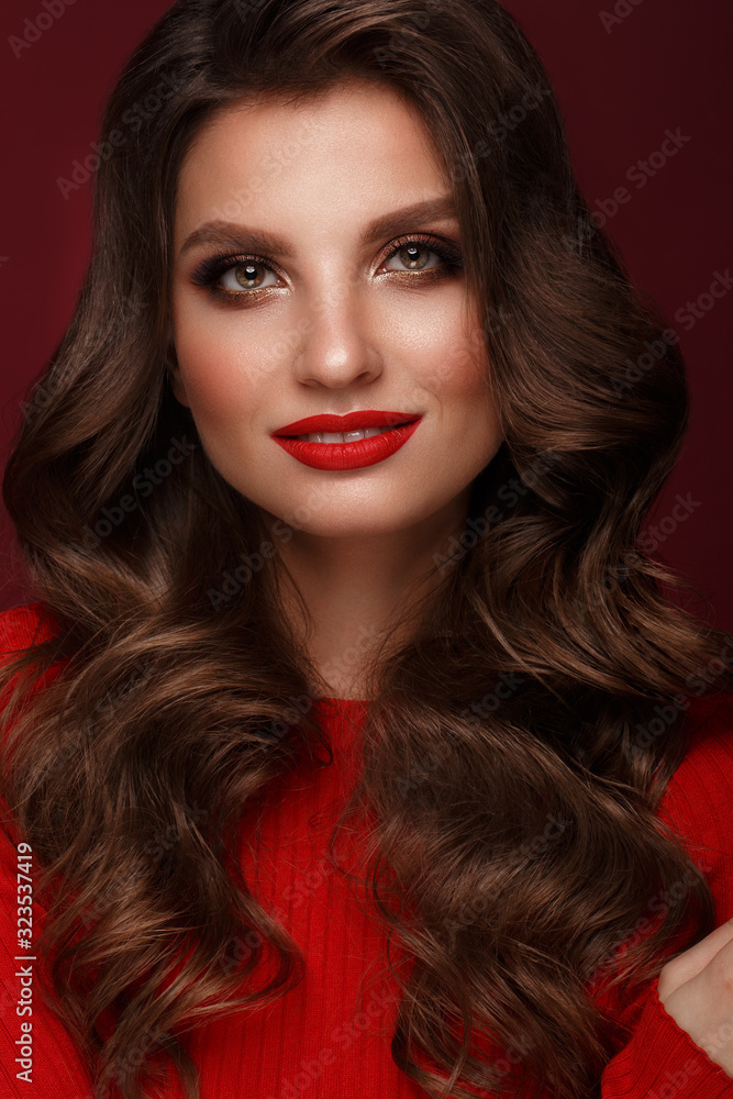 Beautiful sexy woman with classic make-up, wave hair and red lips. Beauty face.