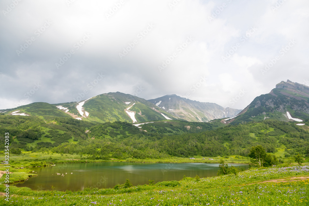 Fototapeta premium Vachkazhets mountain range, Kamchatka Peninsula, Russia. These are the remains of an ancient volcano, divided as a result of a strong eruption into several parts. Regional monument of nature.