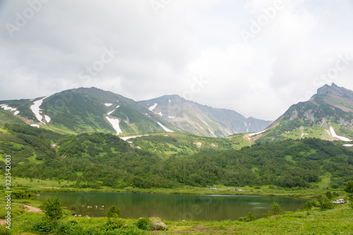 Vachkazhets mountain range, Kamchatka Peninsula, Russia. These are the remains of an ancient volcano, divided as a result of a strong eruption into several parts. Regional monument of nature. photo