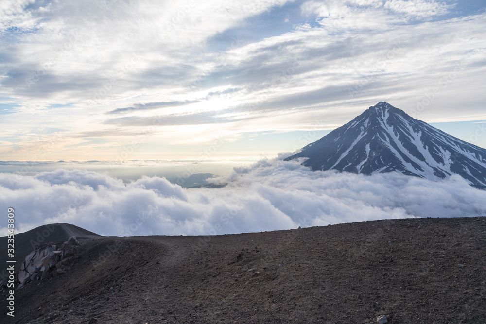 Fototapeta premium Koryaksky volcano, Kamchatka peninsula, Russia. An active volcano 35 km north of the city of Petropavlovsk-Kamchatsky. The absolute height is 3430 meters above sea level.