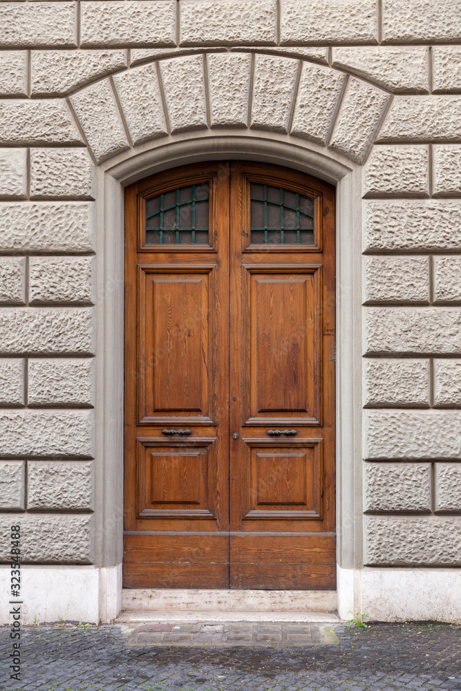 ancient wooden arched door, Italy Europe	