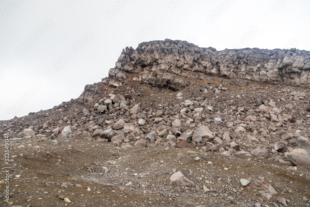 Fototapeta premium Gorely Volcano, Kamchatka Peninsula, Russia. An active volcano located in the south of Kamchatka. It consists of 11 cones and about 30 craters. Some craters are filled with acid or fresh water.