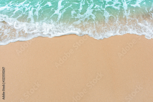 Fototapeta Naklejka Na Ścianę i Meble -  Summer beach concept - Soft wave of sea on empty sandy beach Background with copy space.
