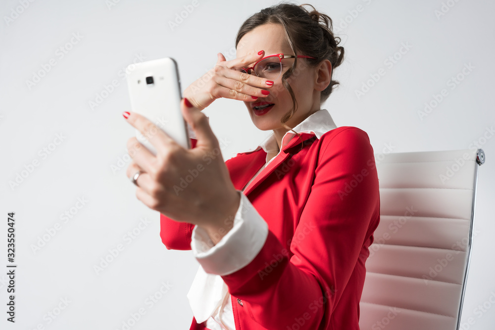 Businesswoman cannot even look at the screen of her phone Businesswoman cannot even look at the screen of her phone
