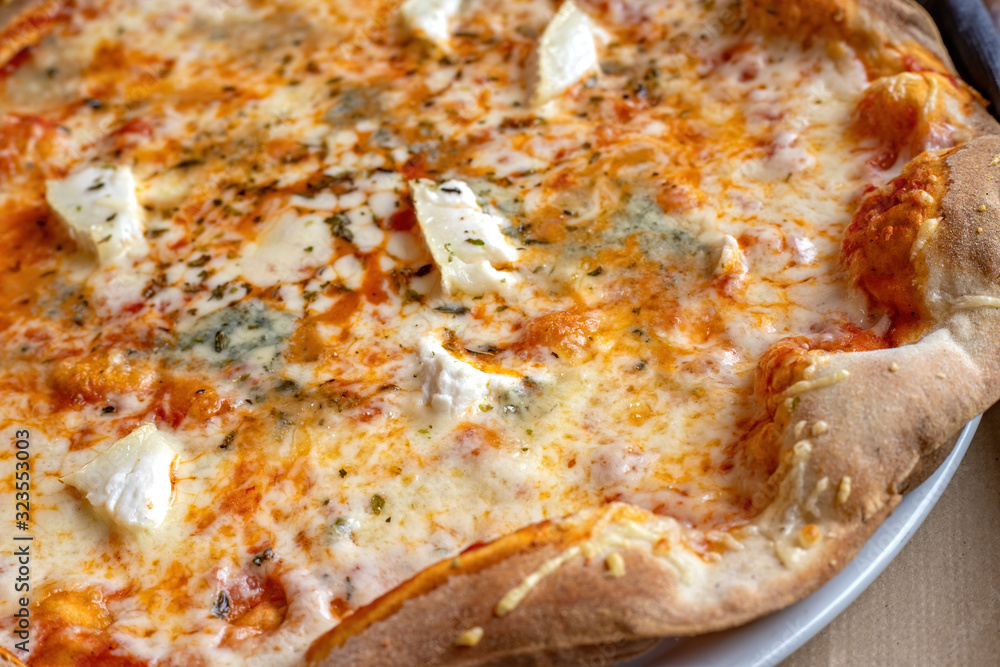 Delicious cheese pizza close-up in restaurant Delicious cheese pizza close-up in restaurant