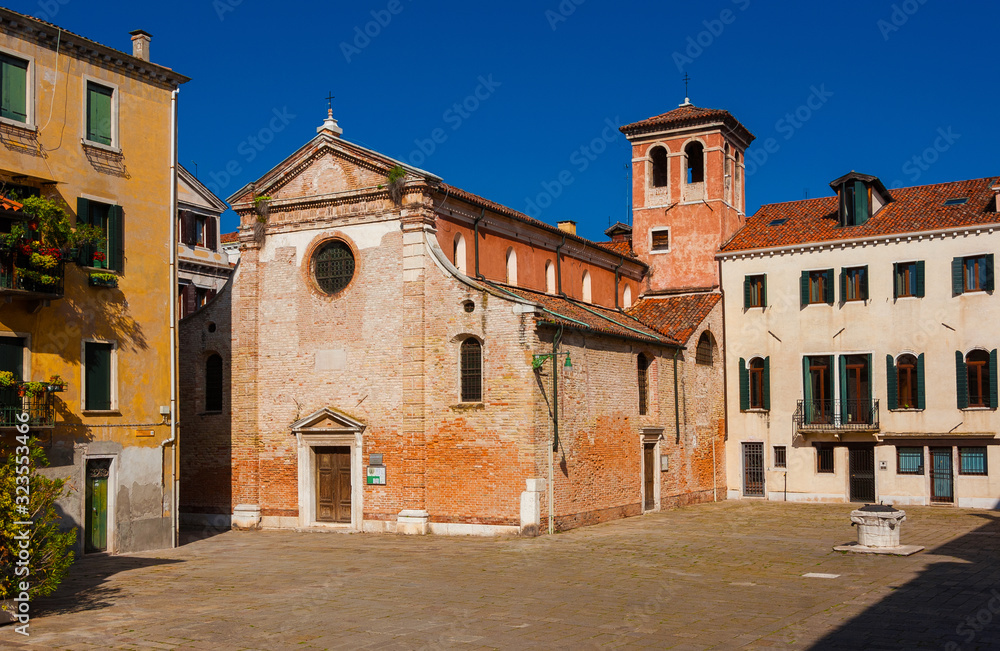 The church of San Zan Degola (St John the Baptist beheaded) and square with ancient well in Venice, completed in the 18th century