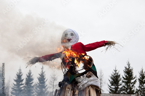 Burning winter doll eastern tradition in spring photo