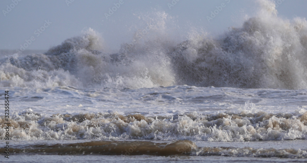 Waves reaching a sheltered Cornish beach in February  2020 brought  by Storm Dennis