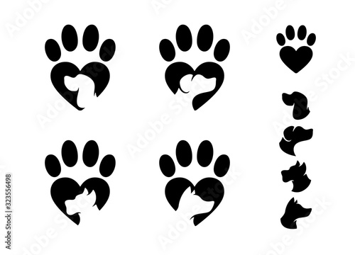Dog paw shaped hearts emblems with dog faces. Vector illustration.