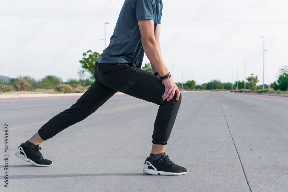 Man stretching his body with sportswear Man stretching his body with sportswear