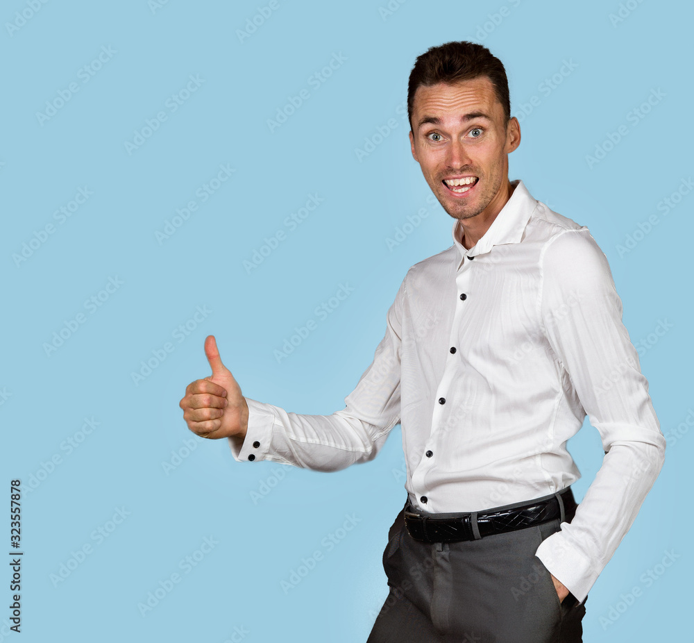 Excited manager gesturing thumb up and looking at camera Excited manager gesturing thumb up and looking at camera