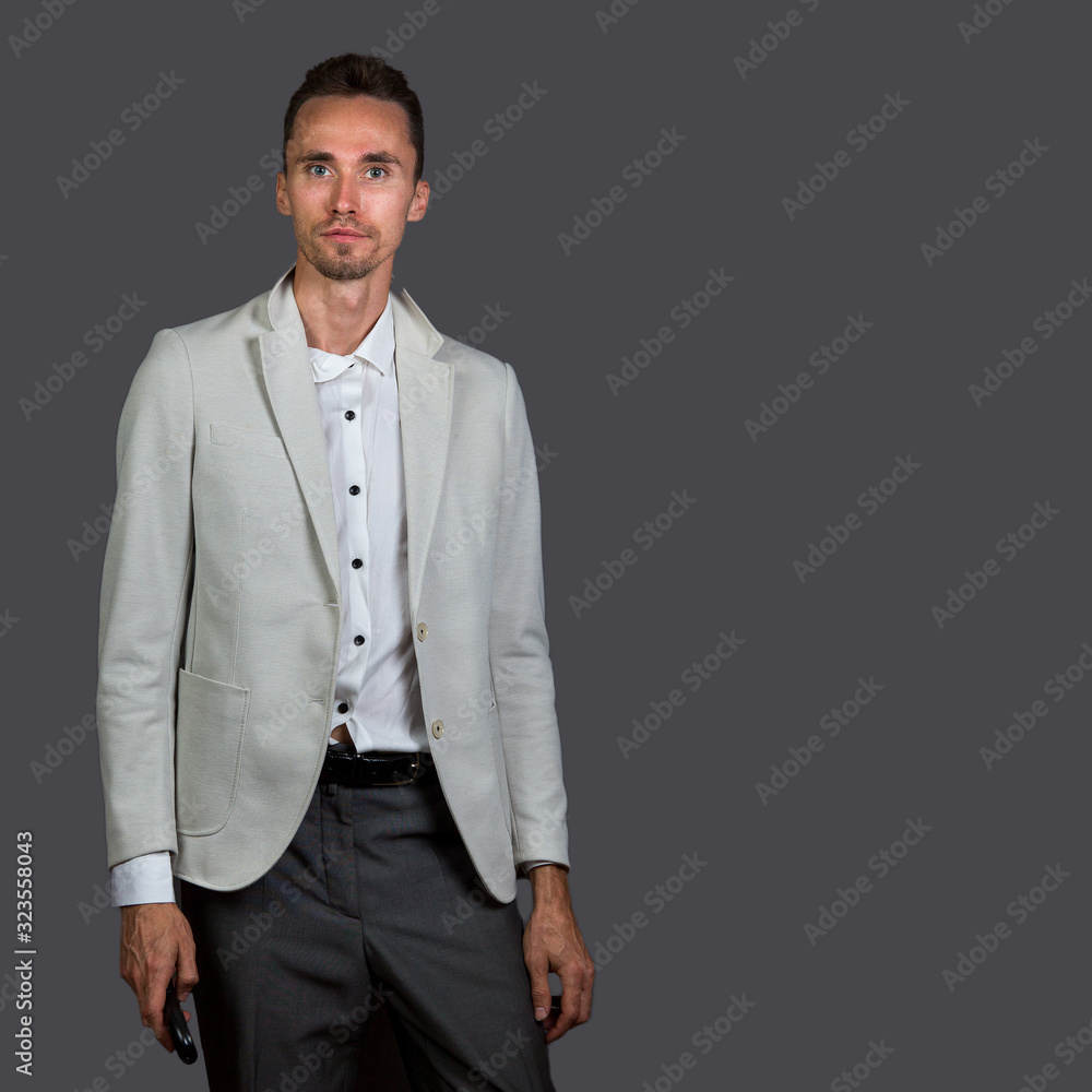 Fototapeta premium Seriuos manager gesturing thumb up and looking at camera