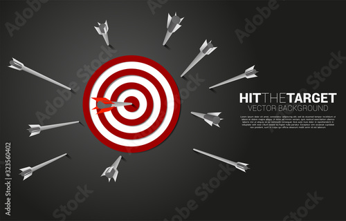 one of arrow archery hit the center of dartboard . Business Concept of missing the marketing target and customer.success on company mission and goal.