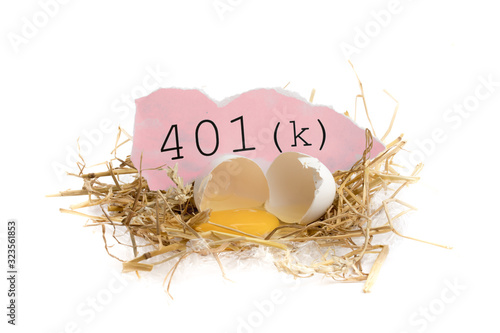 illustrating risk of losses in your retirement savings, a broken egg in a straw nest and text isolated on white