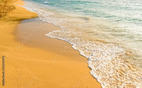 Beautiful beach and tropical sea. Sand and water vacation background.