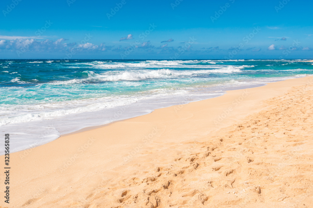 Beautiful beach and tropical sea. Sand and water vacation background.