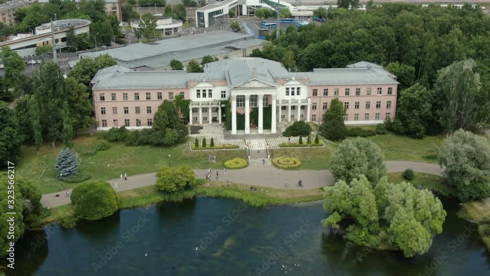Flies over the entrance to the Botanical Garden in Moscow, in the frame of the lake and trees, aerial video Flies over the entrance to the Botanical Garden in Moscow, in the frame of the lake and trees, aerial video