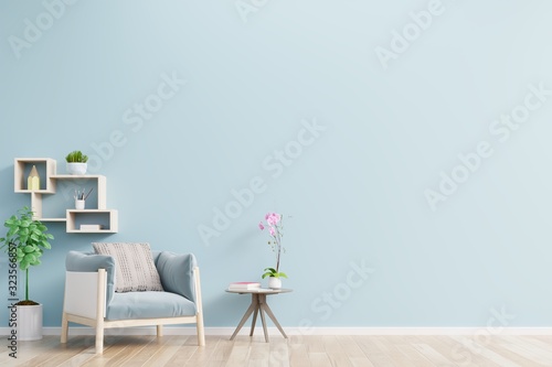The interior has a armchair on empty blue wall background.