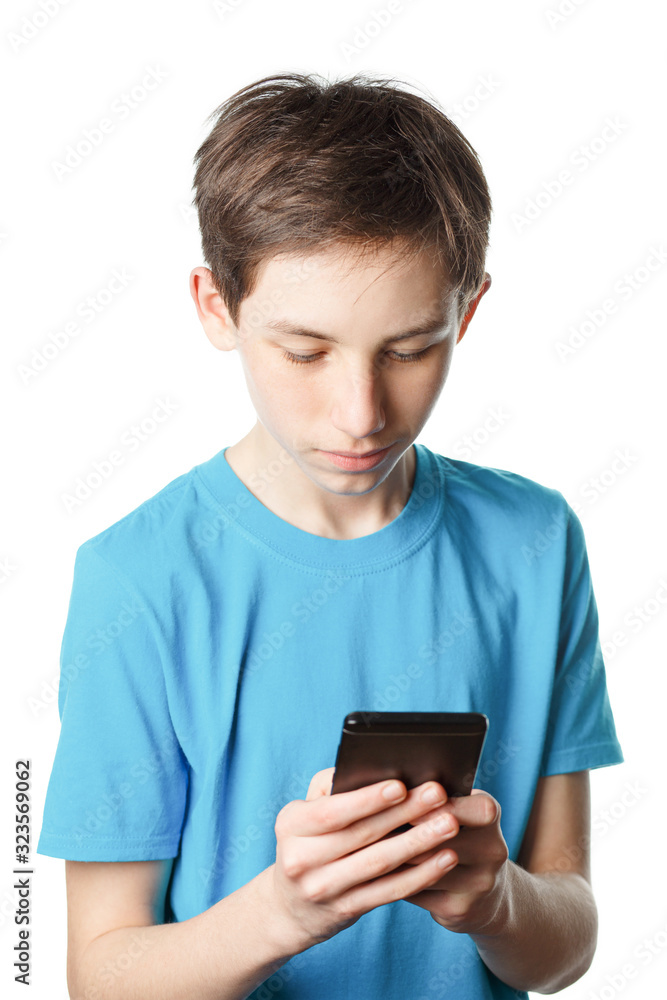 Teenager holds phone in his hands Teenager holds phone in his hands