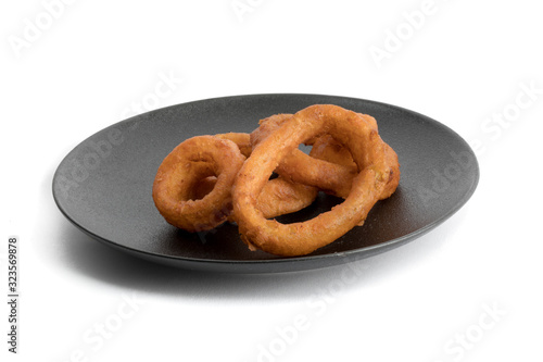 jumbo onion rings on aplate isolated on white photo