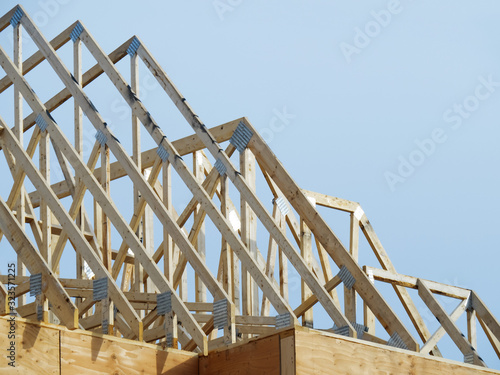 Bild auf Leinwand residential house construction roof trusses not yet covered by roofing
