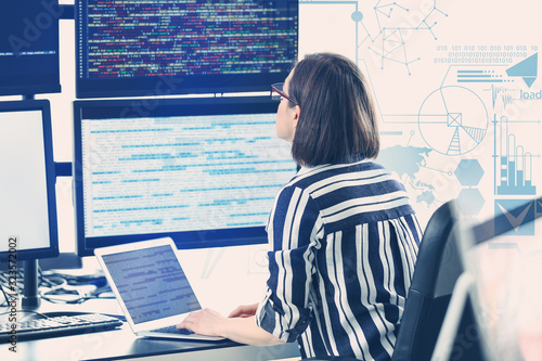 Female programmer working i...