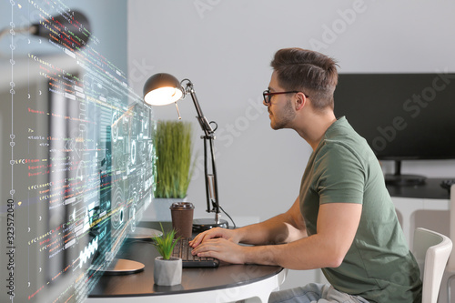 Male programmer working in office photo