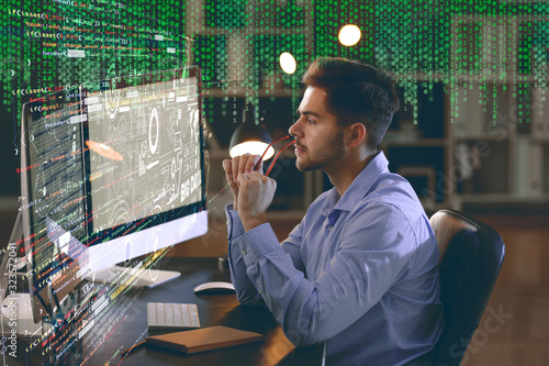 Male programmer working in ...