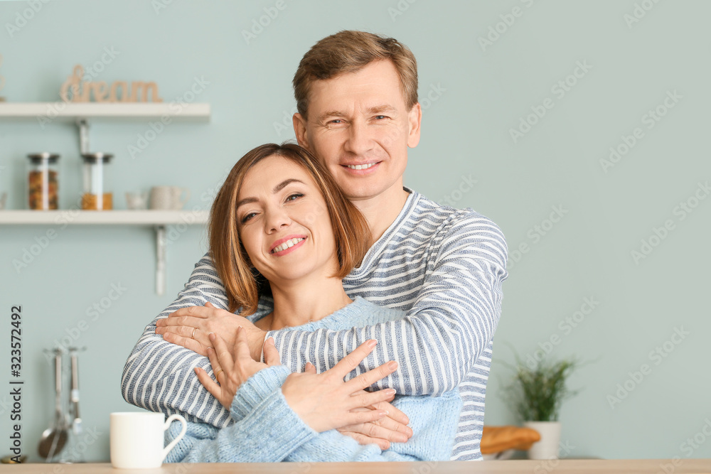 Portrait of beautiful couple in kitchen Portrait of beautiful couple in kitchen