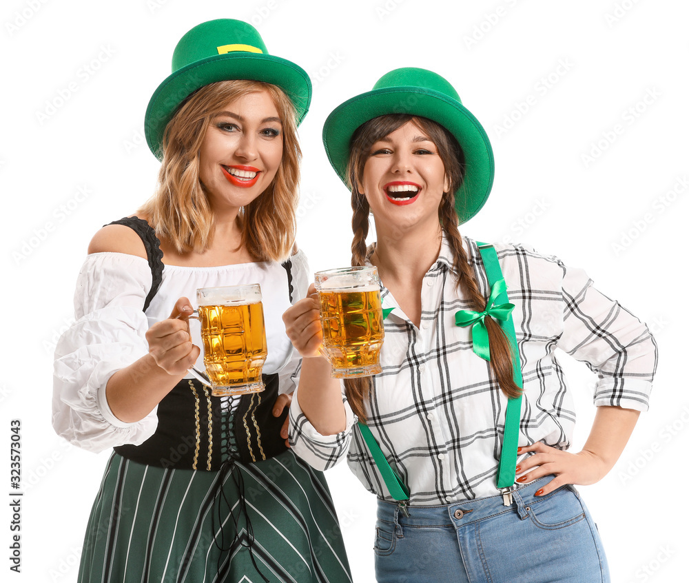 Funny young women with beer on white background. St. Patrick's Day celebration Funny young women with beer on white background. St. Patrick's Day celebration