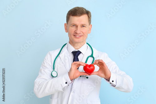 Male cardiologist on color ...