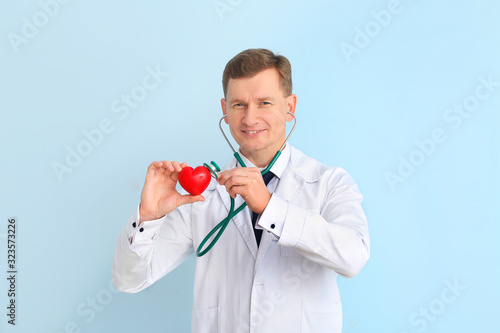 Male cardiologist on color ...