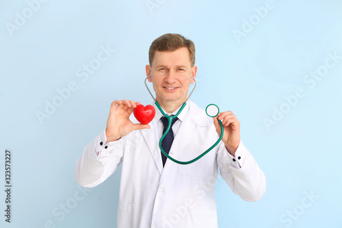 Male cardiologist on color ...