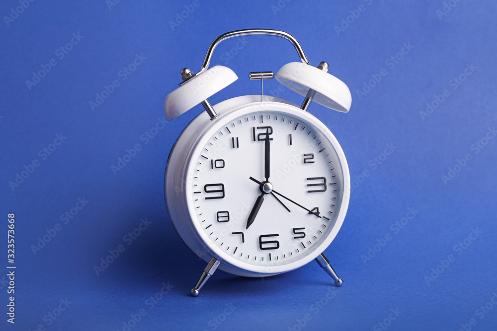 Alarm clock on color background. Time management concept Alarm clock on color background. Time management concept